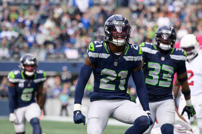 Seattle Seahawks cornerback Devon Witherspoon (21) celebrates after the defense made a play against the Arizona Cardinals during the second half at Lumen Field.